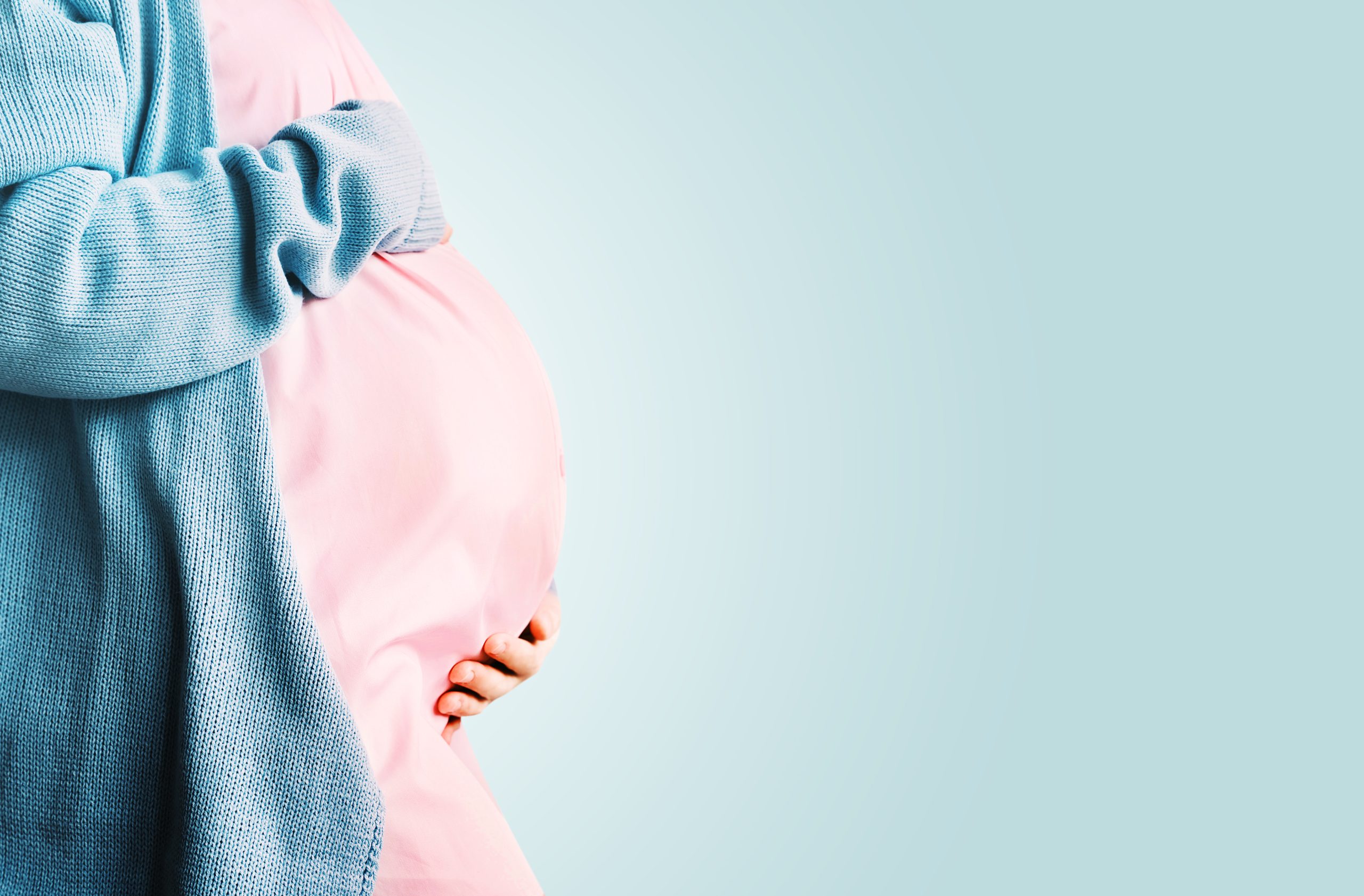 pregnant-woman-holding-hands-on-her-belly-pregnan-2025-03-10-06-32-15-utc-scaled